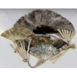 A 19th century French mother-of-pearl and paper folding fan, the gilt and pierced guards and