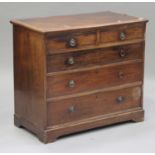 A Victorian mahogany chest of two short and three long drawers, with chequer stringing, on bracket