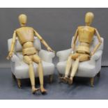 A pair of modern carved beech life-size fully articulated artist's mannequins, both male, height