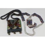 A late 19th century beadwork purse, worked with vases of flowers and with a long shoulder strap,