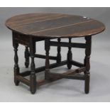 A late 18th/early 19th century oak oval gateleg supper table, fitted with a single frieze drawer, on