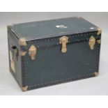 An early 20th century brass bound travelling trunk, the hinged lid revealing removable trays, with