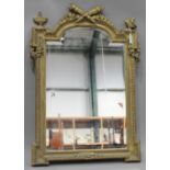A 19th century Neoclassical Revival gilt composition arched rectangular wall mirror, the crossed