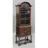 A late 19th/early 20th century William and Mary style walnut display cabinet-on-stand, the arch