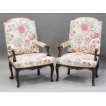 A pair of early 20th century French beech framed fauteuil open armchairs, upholstered in floral