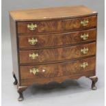 A 20th century George III style walnut bowfront chest, fitted with four long drawers, on cabriole