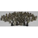 A collection of one hundred and nineteen silver thimbles, including a German sterling example,