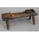 A 19th century elm and pine cobbler's bench, the rectangular top on four staked legs, height 36cm,