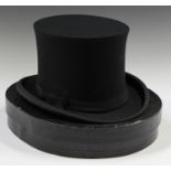 An early 20th century black fabric collapsible top hat by Tress & Co, London, head circumference