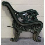 A pair of 20th century cast iron bench ends of foliate scrolling form, height 76cm.Buyer’s Premium