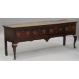 A 19th century oak dresser base, fitted with four drawers, on cabriole legs and pad feet, height