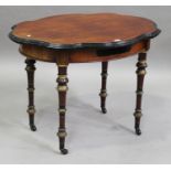 A late Victorian mahogany and ebonized shaped oval centre table, the turned legs with gilded and