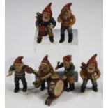 A set of six early 20th century cold painted cast bronze figures of dwarves, each playing a