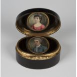An early 19th century tortoiseshell and gold plate mounted oval snuff box, the double-hinged lid