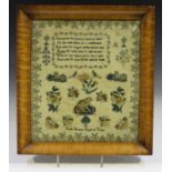 A Victorian needlework sampler by Emily Shotter, aged 10 years, the six lines of pious verse above a