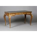 An early 20th century Louis XV style kingwood bureau plat, with applied gilt metal foliate mounts