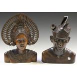 A pair of Balinese carved hardwood head and shoulders busts, finely modelled as a lady with