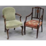 An Edwardian mahogany elbow chair, the back panel inlaid with a floral spray, height 96cm, width