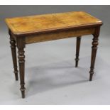 A late Victorian walnut rectangular card table, the top hinged to reveal a surface inset with baize,