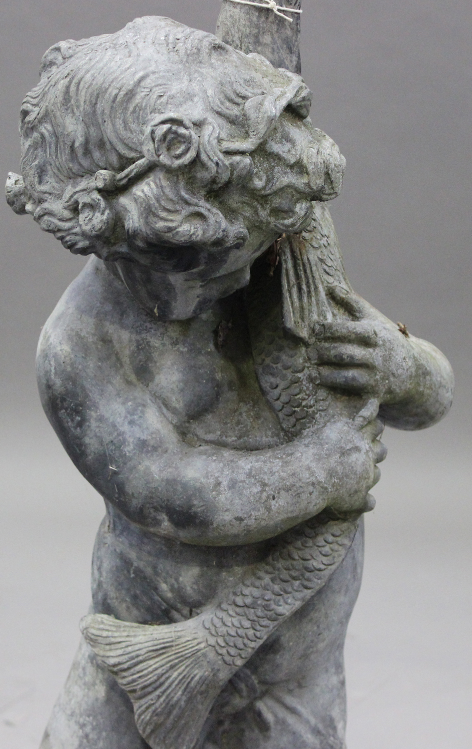 An early 20th century lead garden fountain figure of a standing putto holding a pike, height 98cm. - Image 2 of 2