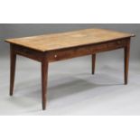 A 19th century French fruitwood kitchen table, fitted with a small frieze drawer, raised on square