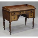 An early Victorian mahogany dressing table, the galleried top above four drawers, on turned legs,