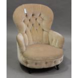 A Victorian tub back armchair, upholstered in light pink velour, on turned legs, height 69cm,