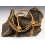 A Louis Vuitton shoe bag, the monogram canvas body with tan leather trimming and handles, length