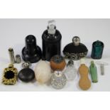 A selection of late 19th century and later scent bottles and phials, including a carved alabaster