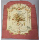 A 19th century tapestry panel, finely worked with a hanging basket of flowers, within a shaped