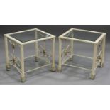 A pair of modern cream and gilt painted metal occasional tables with glass tops and undertiers,