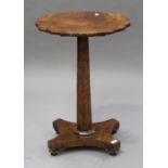 A 19th century and later pollard oak and walnut wine table, the later top with wavy rim, raised on
