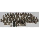A collection of one hundred and seven silver thimbles, including two diminutive examples, a .800