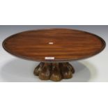 A 19th century mahogany and walnut lazy Susan, the revolving circular top on a shaped base, diameter