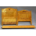 A pair of Art Deco burr maple and ebony inlaid single bed frames, height 110cm, width 94cm, length