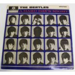 A small collection of LP records, including a stereo first pressing of 'A Hard Day's Night' by The