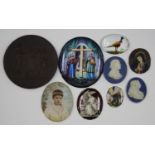 A small group of mainly 19th century porcelain, enamel and glass plaques, including an oval