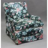 A 20th century Howard style armchair with curved scroll arms, height 88cm, width 79cm.Buyer’s