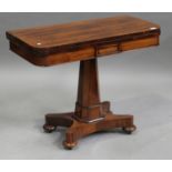 A Regency rosewood fold-over card table, the top hinged to reveal a surface inset with green