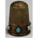 A Victorian gold, turquoise and half-pearl set thimble, the band decorated with alternating