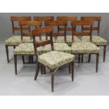 A set of eight George IV mahogany bar back dining chairs with ebony line inlay, the overstuffed