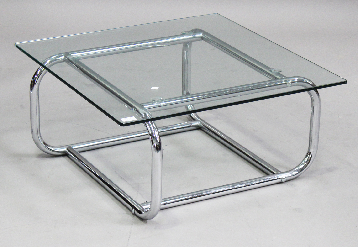 A mid-20th century chromium plated tubular metal and clear glass coffee table, height 33cm, width