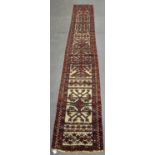 A Turkestan tent band, early/mid-20th century, the ivory flatweave ground with continuous