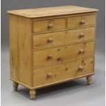 A Victorian stripped pine chest of two short and three long drawers, on turned legs, height 103cm,