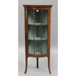 An Edwardian mahogany and boxwood line inlaid glazed bowfront corner display cabinet, on splayed