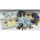 A group of Masonic regalia, including three aprons and medals.Buyer’s Premium 29.4% (including VAT @