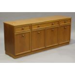 A late 20th century G-Plan teak sideboard, fitted with three drawers above cupboards, on a plinth