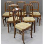 A near set of six early 20th century French walnut dining chairs with bobbin turned spindle backs,