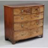 An early Victorian figured mahogany bowfront chest of two short and three graduated long drawers, on