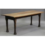 A 19th century fruitwood and oak refectory table, the rectangular top raised on turned legs,